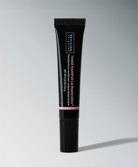 Tinted YouthFull Lip Replenisher® black tube on gray background