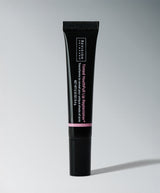 Tinted YouthFull Lip Replenisher® black tube on gray background