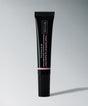 Tinted YouthFull Lip Replenisher® black tube on gray background